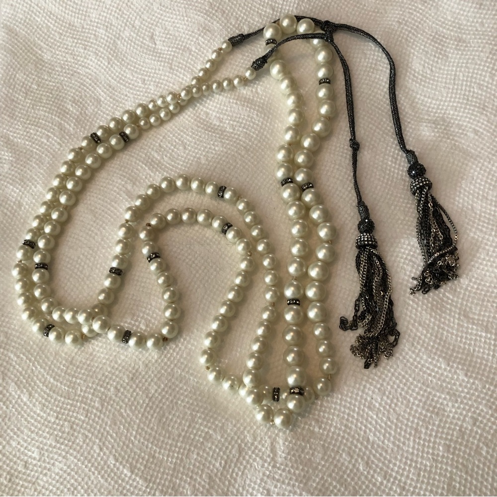White pearls, vintage 20s style with tassels and rhinestones set In black, 48”